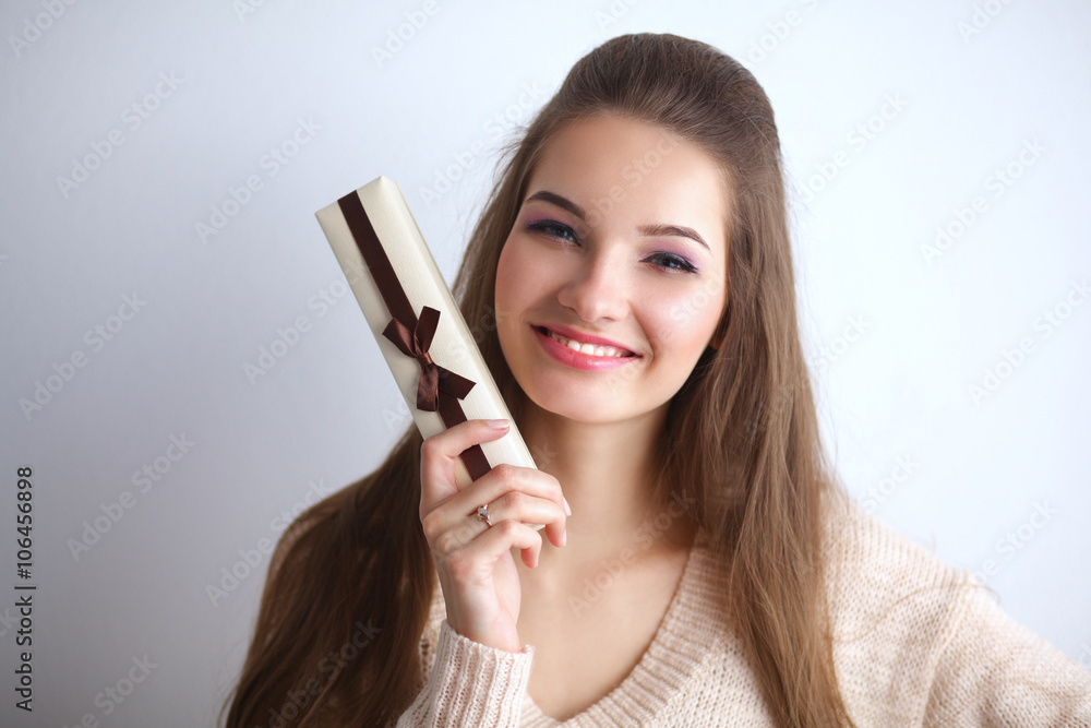 Young woman happy smile hold gift box in hands Young woman happy smile hold gift box in hands