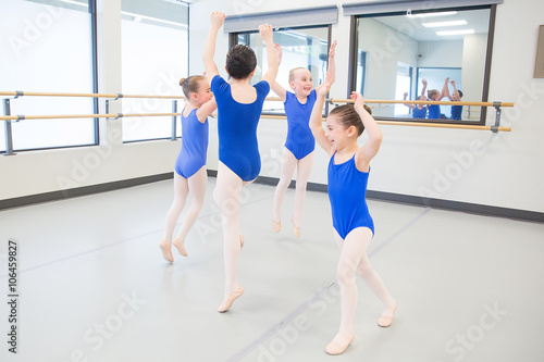 Young children laughing during dance class