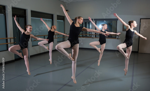 Group of ballet dancers jumping in the air