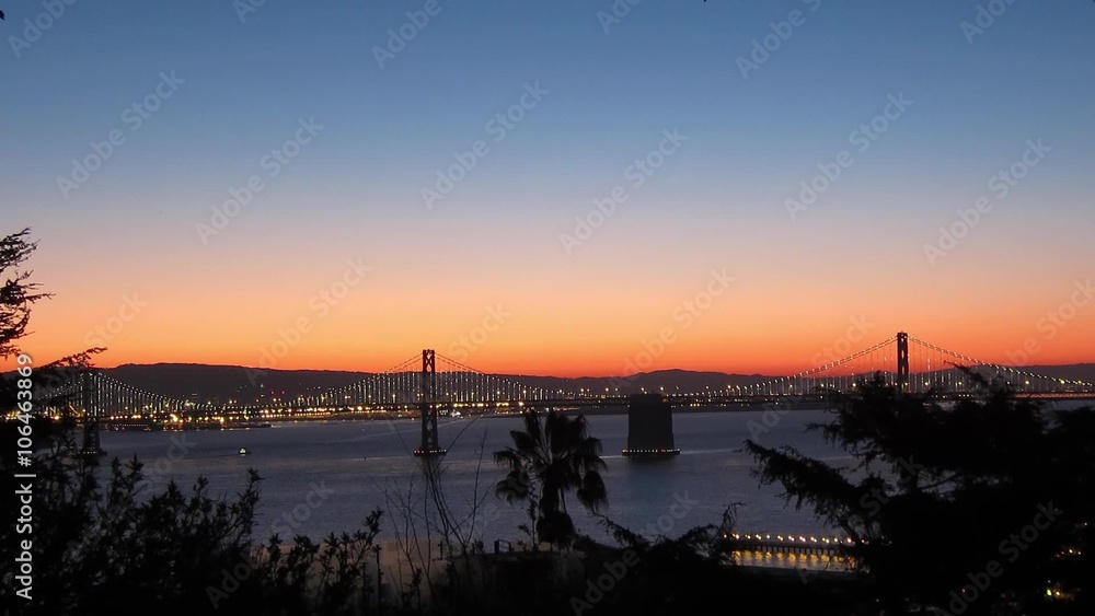 Time-lapse of San Francisco-Oakland Bay Bridge lights at sunrise Time-lapse of San Francisco-Oakland Bay Bridge lights at sunrise