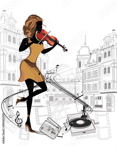 Girl musician playing the violin in the streets