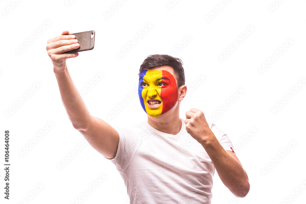 Romanian football fan take selfie photo with phone on white background. European 2016 football fans concept. Romanian football fan take selfie photo with phone on white background. European 2016 football fans concept.
