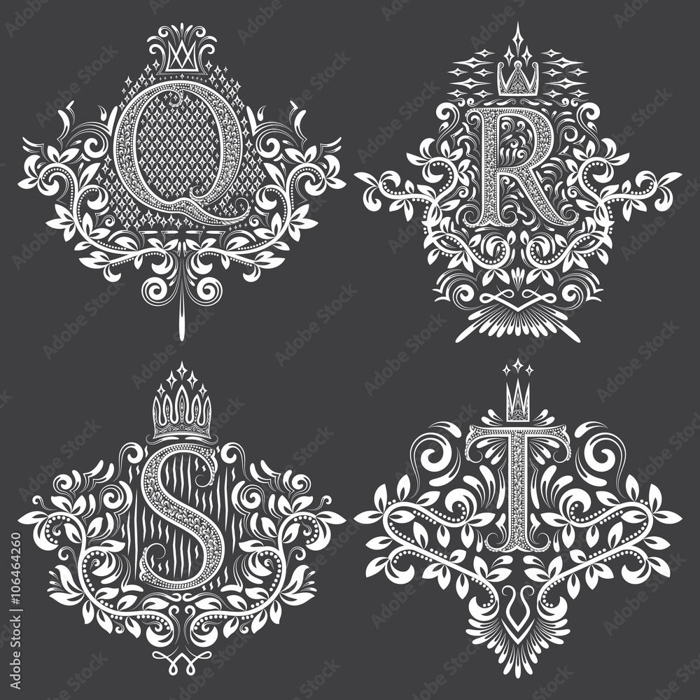 Set of heraldic monograms in coats of arms form. White floral decorative stamps on black. Isolated tattoo labels in vintage baroque style. Set of heraldic monograms in coats of arms form. White floral decorative stamps on black. Isolated tattoo labels in vintage baroque style.