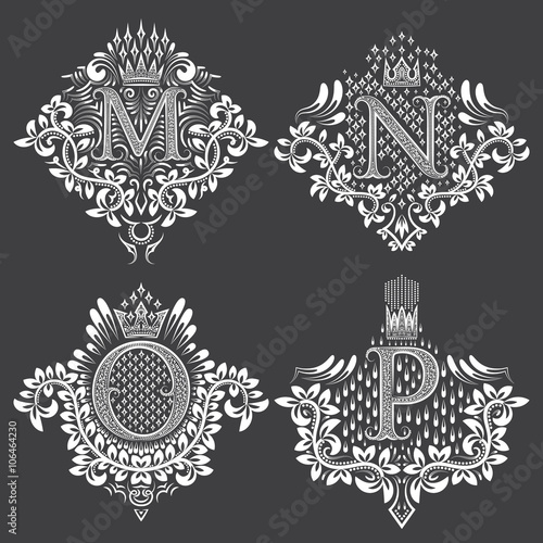 Set of ornamental monogram in coats of arms form. White floral decorations on black. Isolated tattoos in vintage baroque style.
