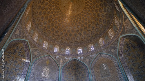 Sheikh Lotfollah Mosque beautiful interior decorated with colorful mosaic, paning from the floor to the breathtaking dome, Isfahan Iran.