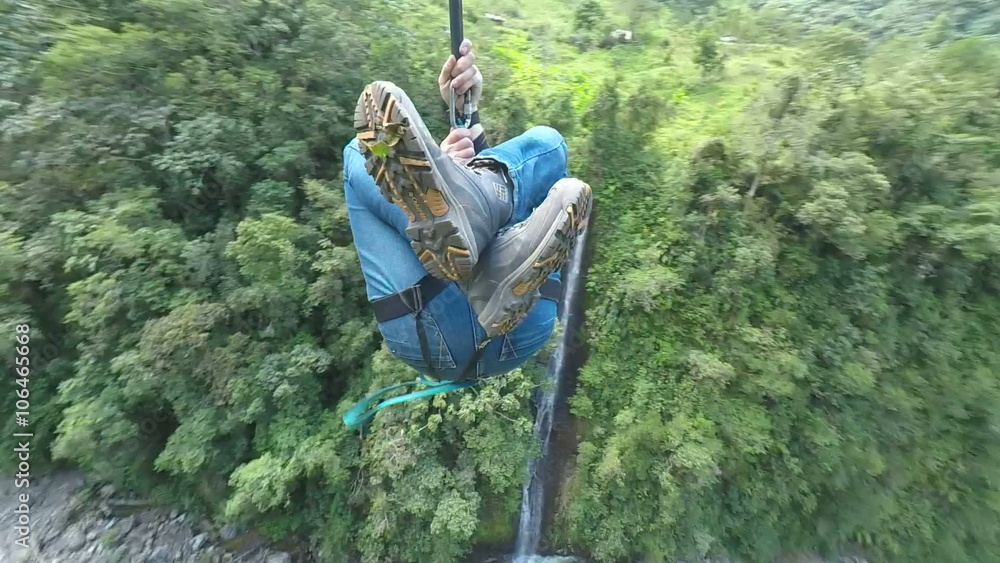 adult human riding a zipline cable mounted camera camera spins