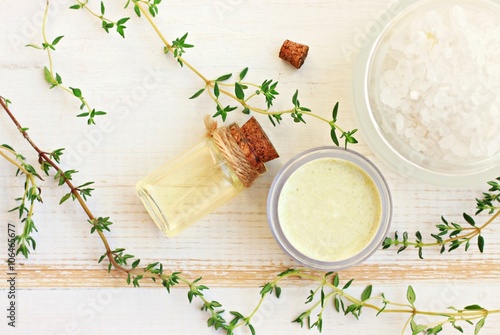 Aroma oil, facial cream, sea salt. Fresh thyme herbs. Herbal remedies. 