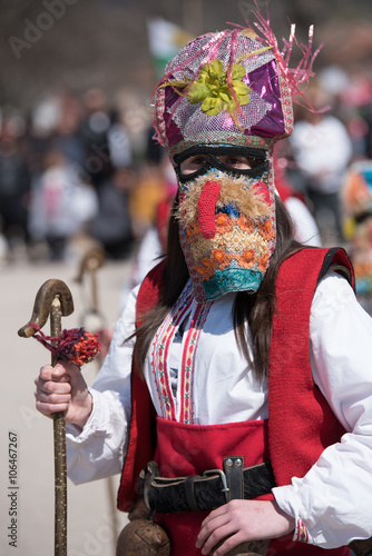 Paisievo, Bulgaria - March 26, 2016: People in costumes are taking part in the festival of Mummers in Paisievo, Bulgaria. Games, dances and activities are organized for viewers.