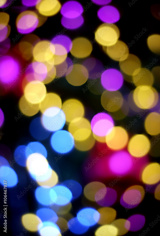 Purple, pink and yellow circle bokeh on dark background Purple, pink and yellow circle bokeh on dark background