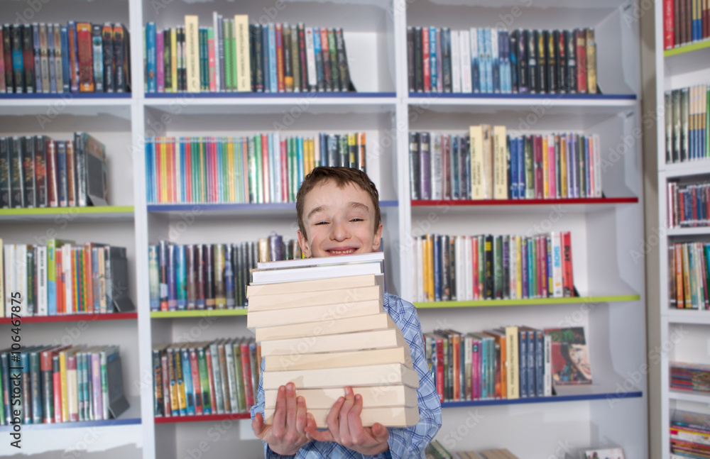 Cute boy reading book in library
Cute boy reading book in library