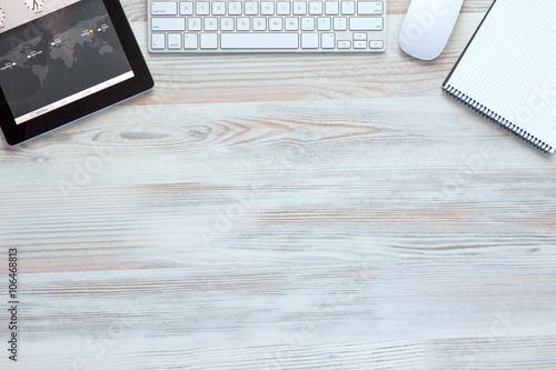 Fotografie Composition with modern Electronics and Stationery Items in Wood Background