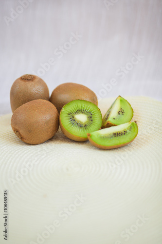 Kiwi fruit on a white background sliced