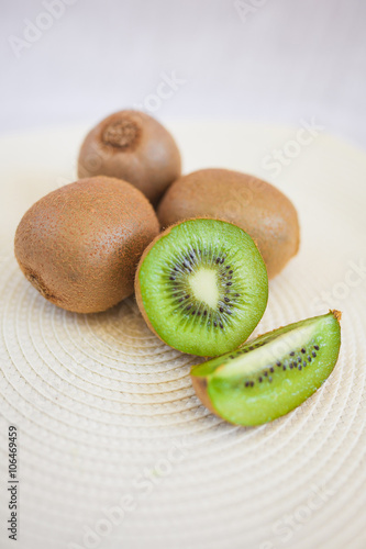 Kiwi fruit on a white background sliced
