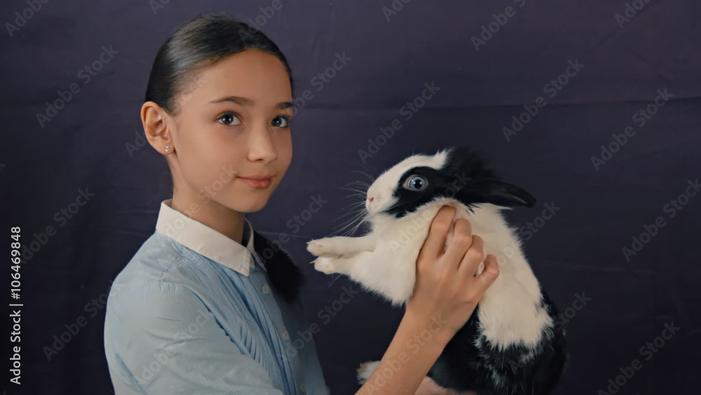 funny easter bunny is playing with the girl. funny easter bunny is playing with the girl.