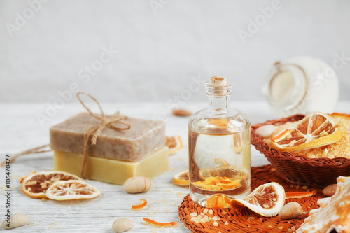 Composition of spa treatment on wooden background. Essential cit