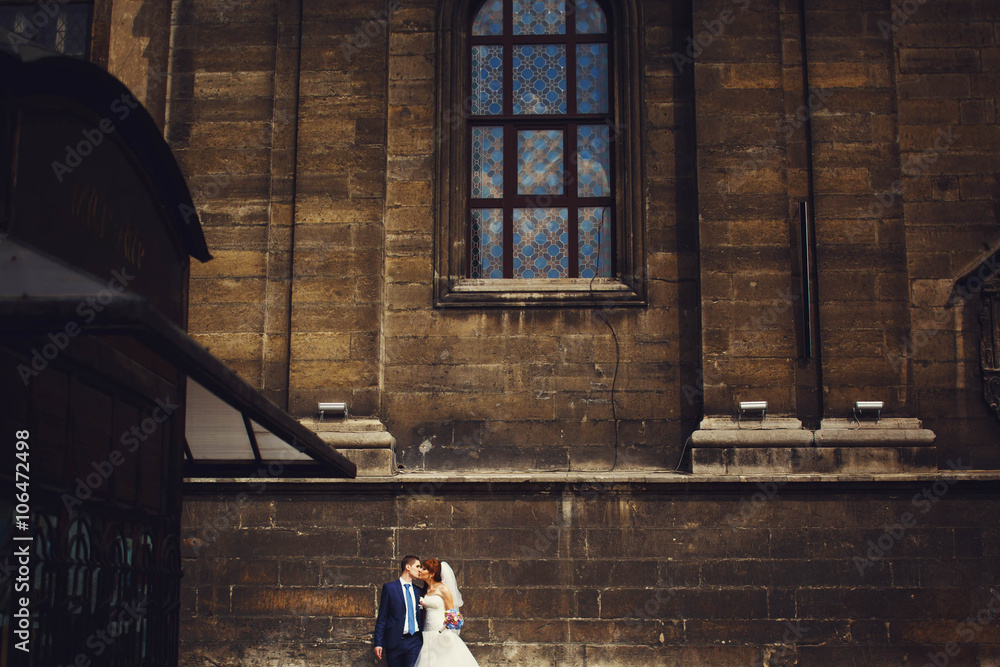 Cute adorable beautiful happy just married couple, stylish bouqu Cute adorable beautiful happy just married couple, stylish bouqu