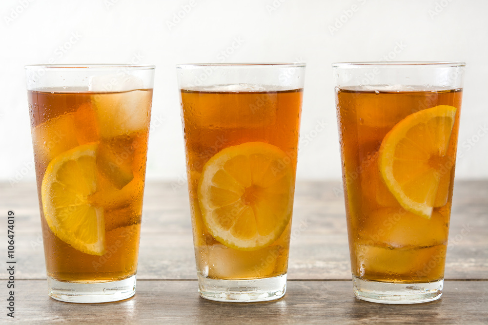 refreshing iced tea with lemon on wood refreshing iced tea with lemon on wood