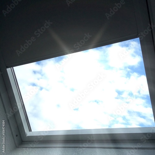 Midday sun is shining through the skylight
