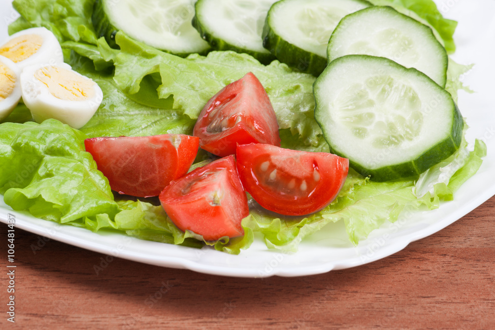 Fresh salad in a white bowl . Fresh salad in a white bowl .
