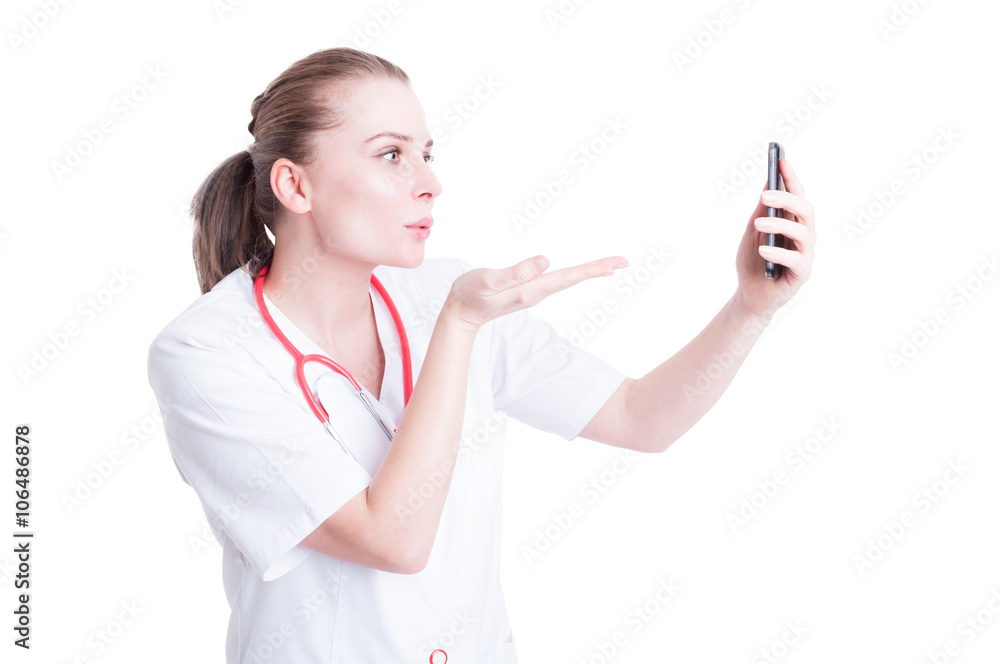 Woman doctor sending blowing kisses on video call Woman doctor sending blowing kisses on video call