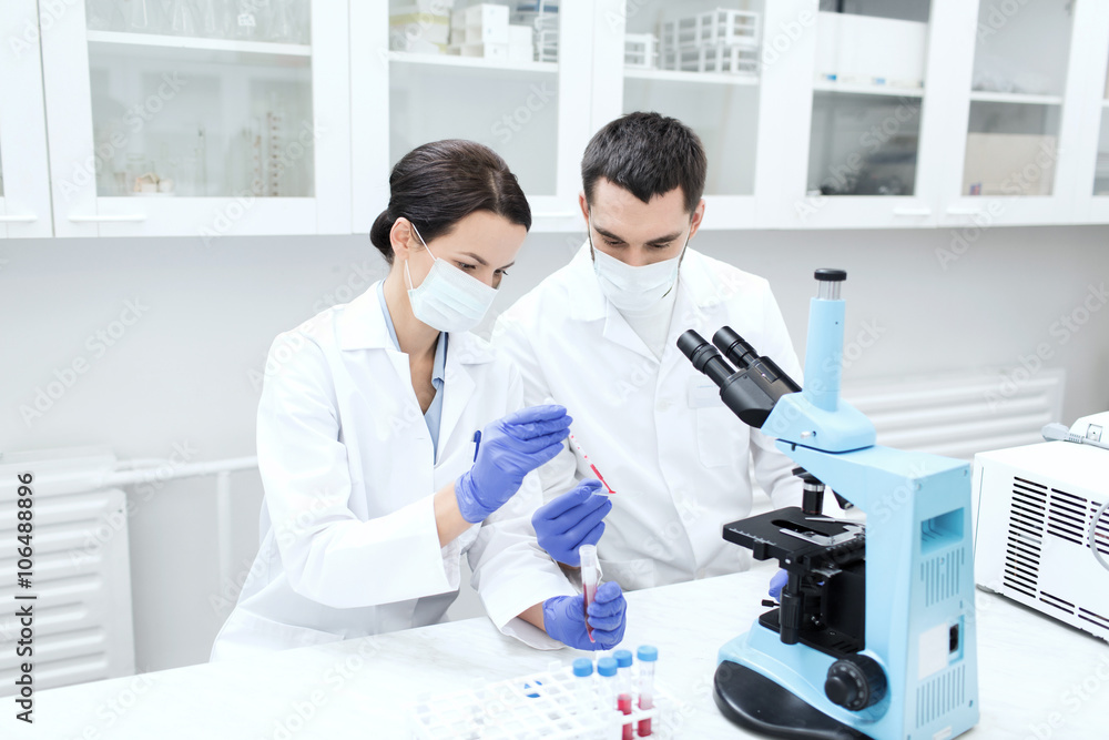 Fototapeta premium young scientists making test or research in lab