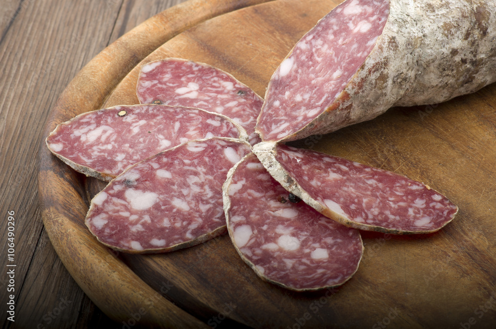 wooden cutting board with salami and bread wooden cutting board with salami and bread