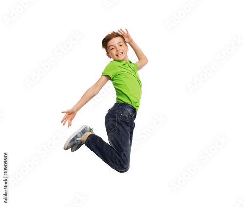 smiling boy jumping in air
