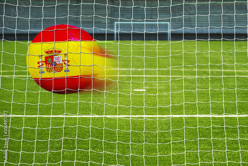Soccer ball with the flag of Spain in the net