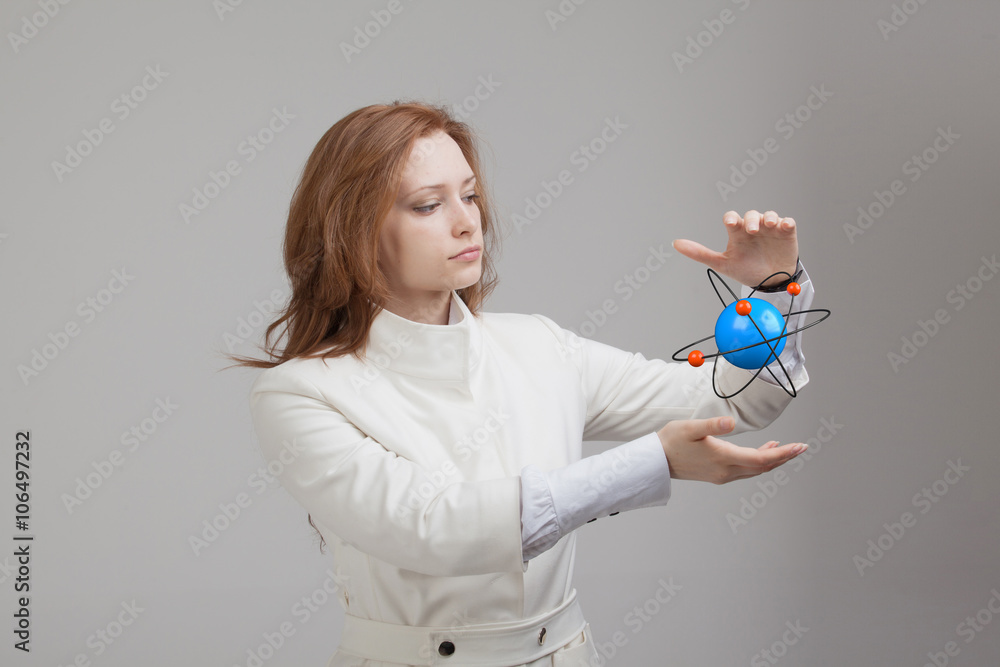 Woman scientist with atom model, research concept Woman scientist with atom model, research concept