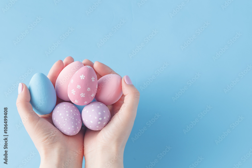 Close up of woman holding colorful Easter eggs Close up of woman holding colorful Easter eggs