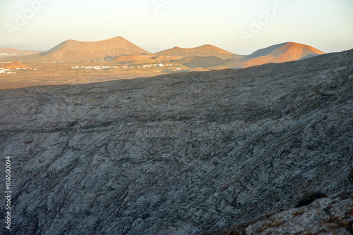 Volcanic landscape view from the top of Caldera Blanca volcano on the sunset on Lanzarote island in Spain