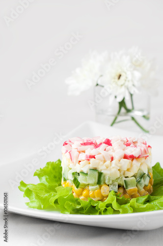 Crab sticks salad on white tablecloth