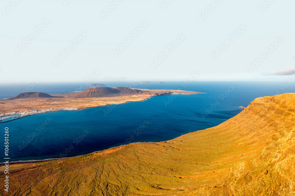 Wide angle view on Graciosa island from El Rio viewpoint on Lanzarote island in Spain