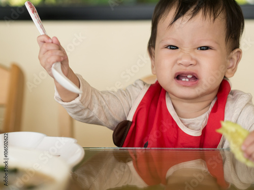 Wallpaper Mural Asian toddler learn to eat meal herself. Torontodigital.ca