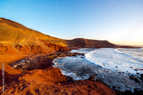 El Golfo bay with fishing boats on the sunset on Lanzarote island in Spain
