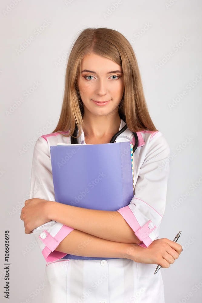 beautiful woman doctor with a stethoscope takes notes beautiful woman doctor with a stethoscope takes notes