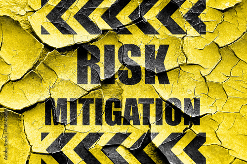 Grunge cracked Risk mitigation sign photo