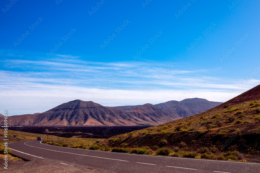 Volcanic landscape on Lanzarote island in Spain. Wide angle view with copy space Volcanic landscape on Lanzarote island in Spain. Wide angle view with copy space