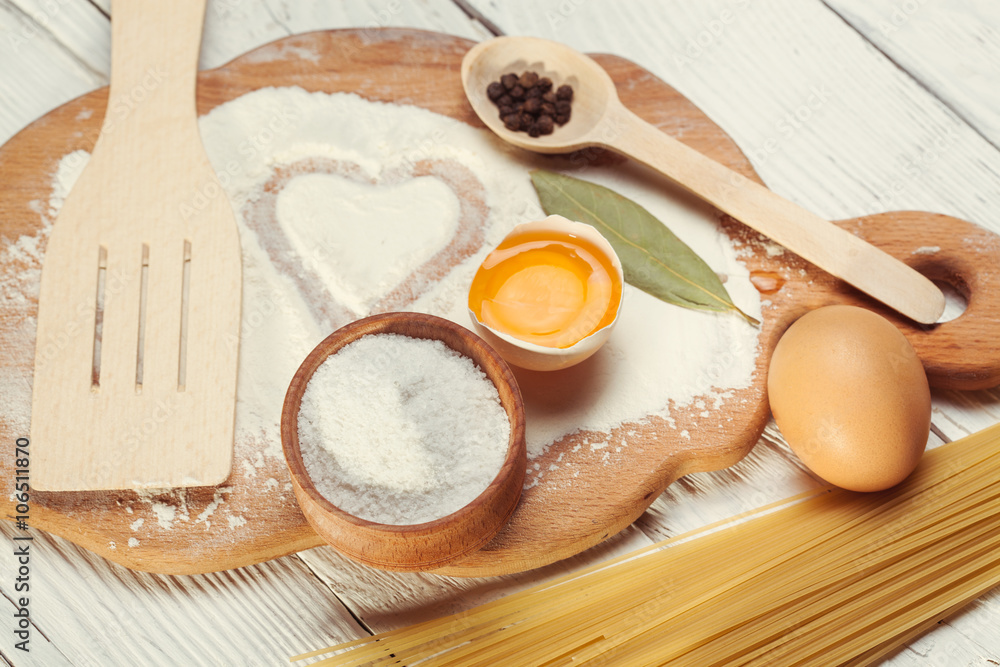 Pasta spaghetti with flour, egg on rustic wooden background Pasta spaghetti with flour, egg on rustic wooden background