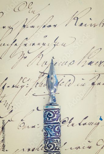 feather pen and letter