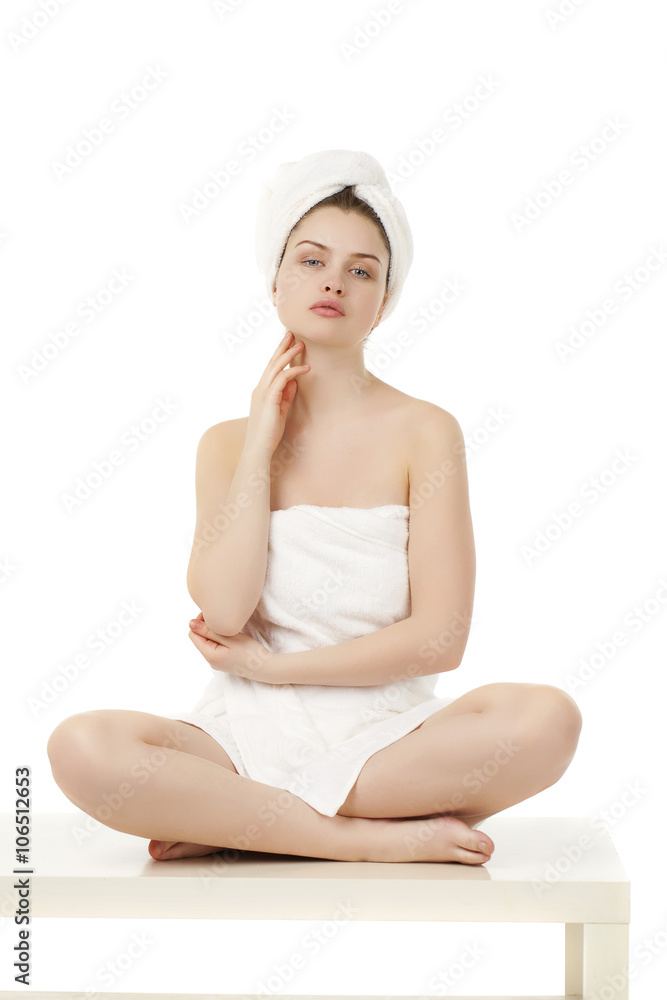 Young woman wrapped towel isolated on white background Young woman wrapped towel isolated on white background