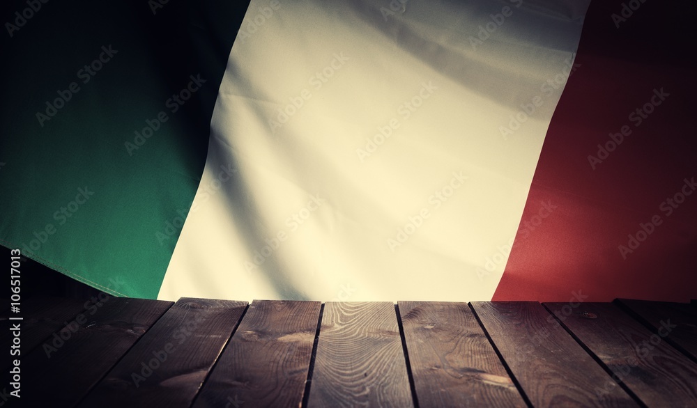 Flag of the Italy with wooden boards as a background. Vintage Style.