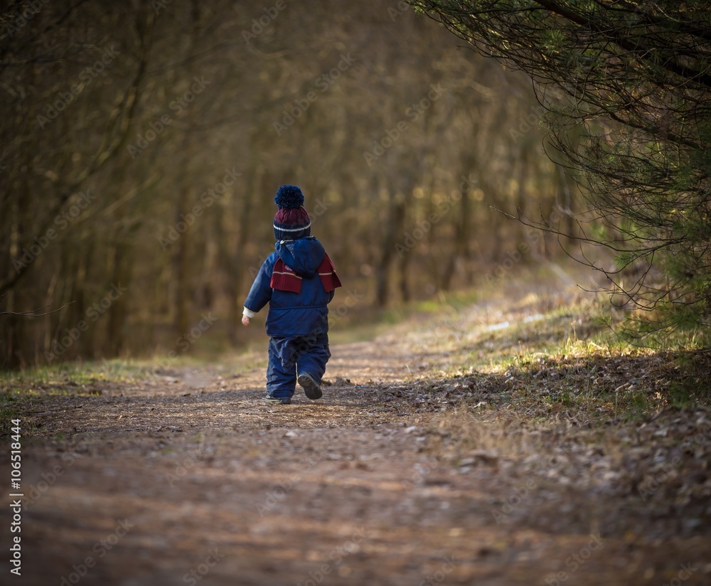 Fototapeta premium Caucasian boy playing outdoor at springtime
