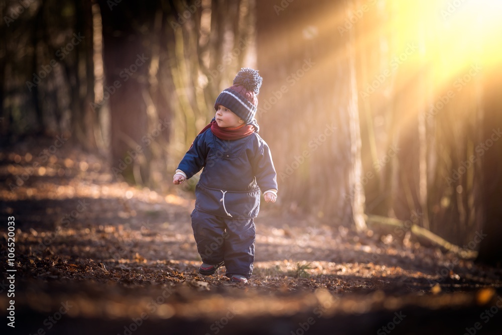 Caucasian boy playing outdoor at springtime Caucasian boy playing outdoor at springtime