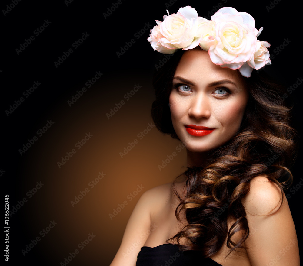 Beautiful Young Woman with Summer Pink Flowers. Long Permed Curly Hair and Fashion Makeup. Beauty Girl with Flowers Hairstyle. 