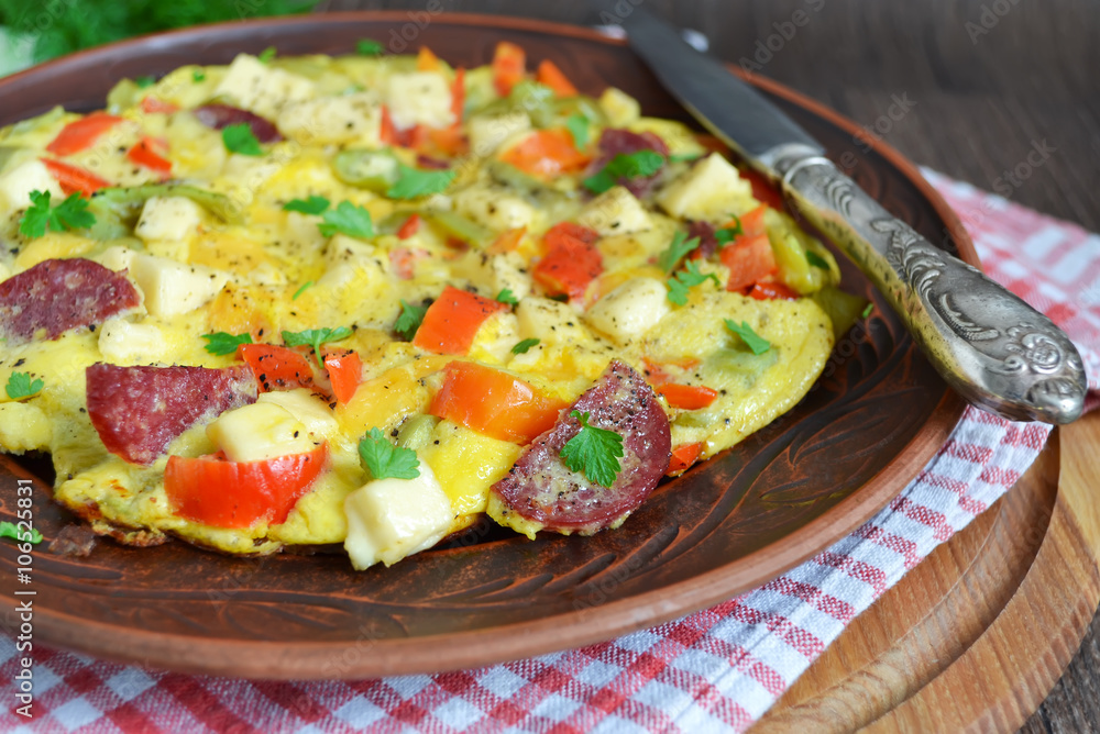 Frittata with peppers, salami and cheese, Italian breakfast