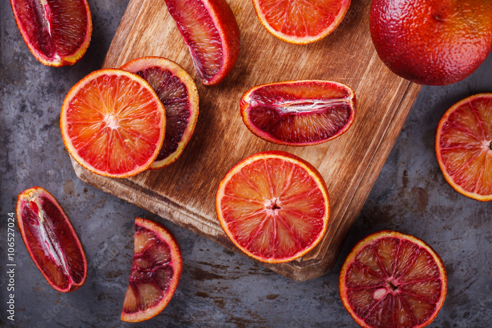 blood orange on a wooden Board,cut into wedges.selective focus. blood orange on a wooden Board,cut into wedges.selective focus.
