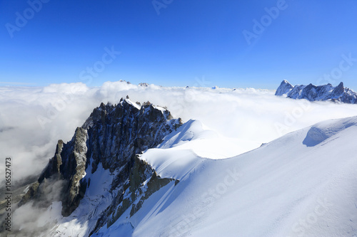 Mont Blanc mountain peak above low clouds