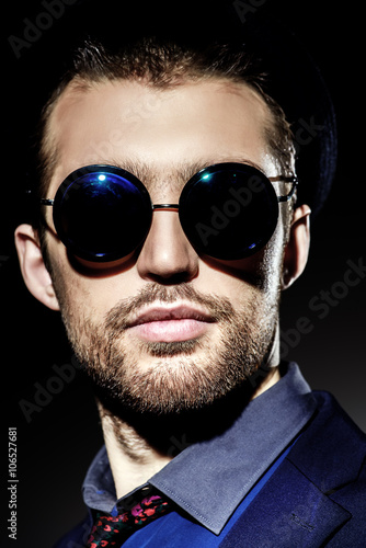 man in round glasses