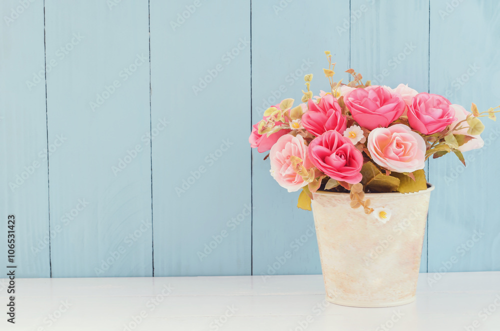 Naklejka premium Pastel Artificial Pink Rose in flower pot